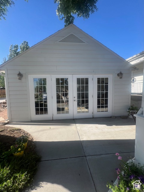 Rear view of house featuring french doors and a patio area