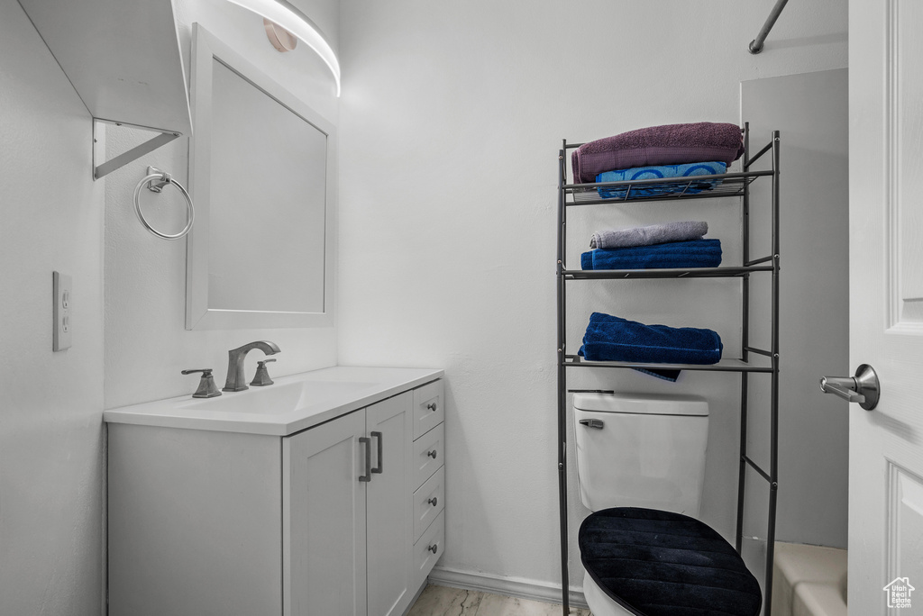 Bathroom with vanity and a tub to relax in