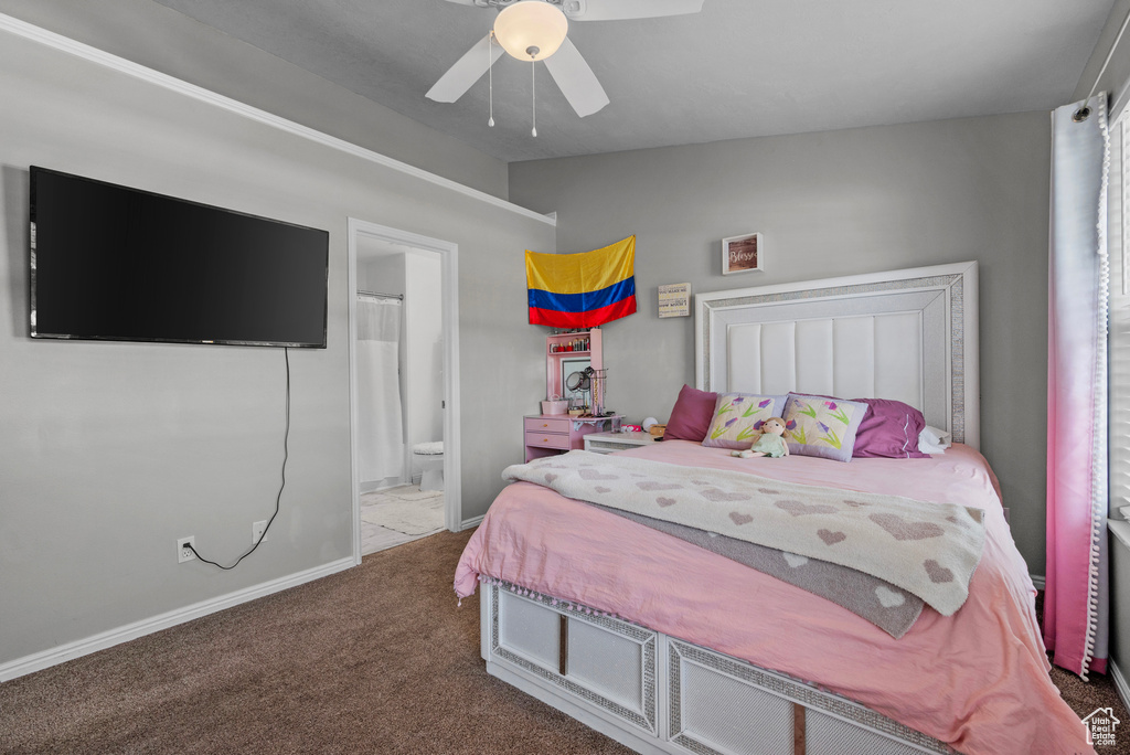 Bedroom with lofted ceiling, carpet, ensuite bathroom, and ceiling fan