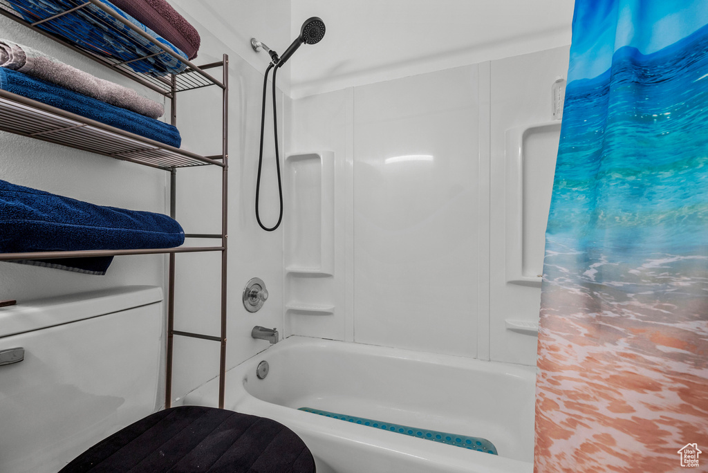 Bathroom with shower / bath combo with shower curtain