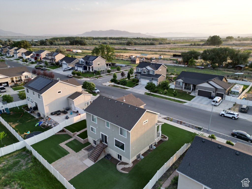 Aerial view of residential area featuring a mountainous background