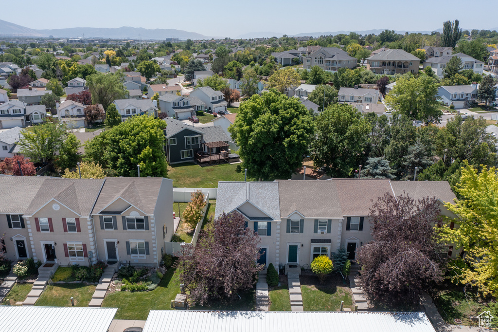 Aerial view of residential area featuring a mountainous background