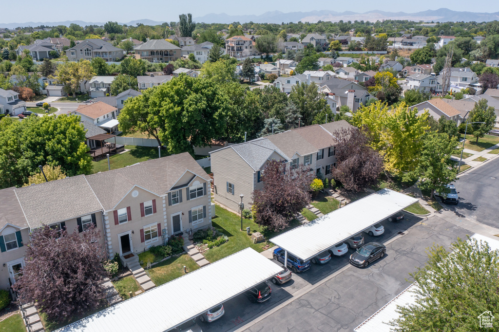 Aerial perspective of suburban area featuring a mountain backdrop