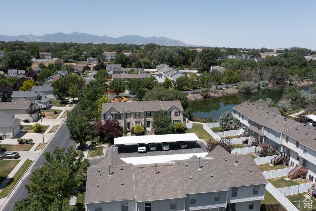 Aerial perspective of suburban area with a water and mountain view