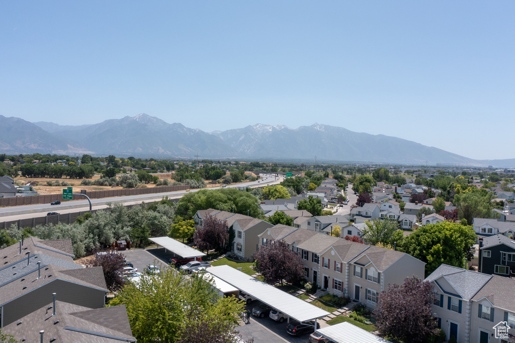 Aerial perspective of suburban area with a mountainous background