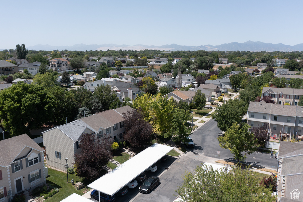 Aerial view of residential area featuring a mountainous background
