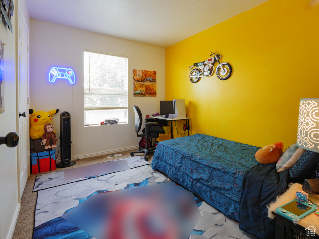 Bedroom with carpet floors and baseboards