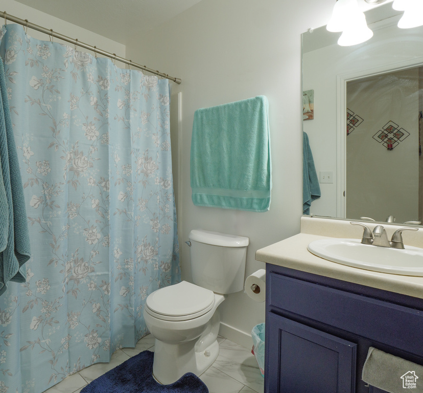 Full bath featuring vanity and a shower with curtain