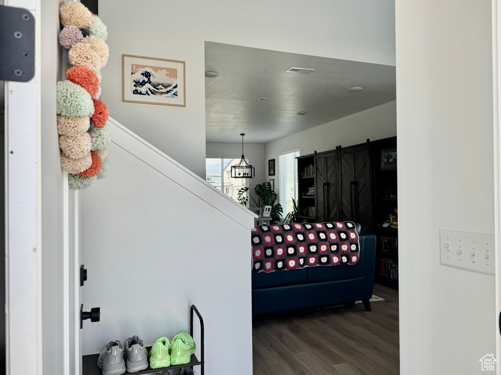 Stairs featuring wood finished floors