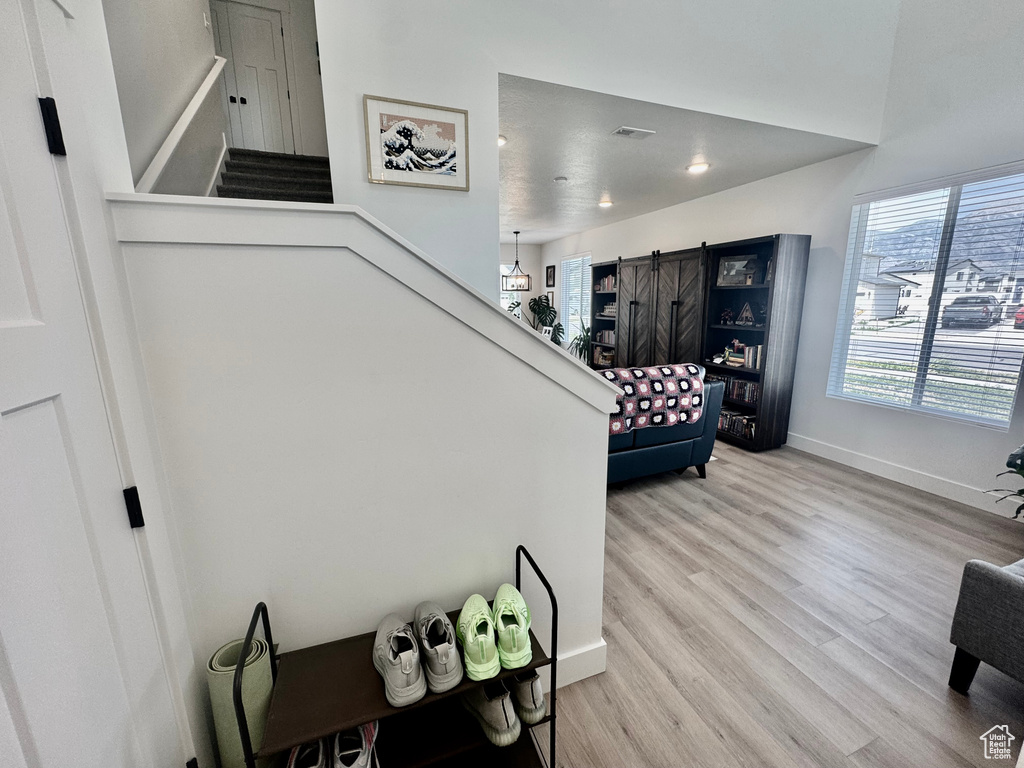 Stairway featuring wood finished floors and baseboards