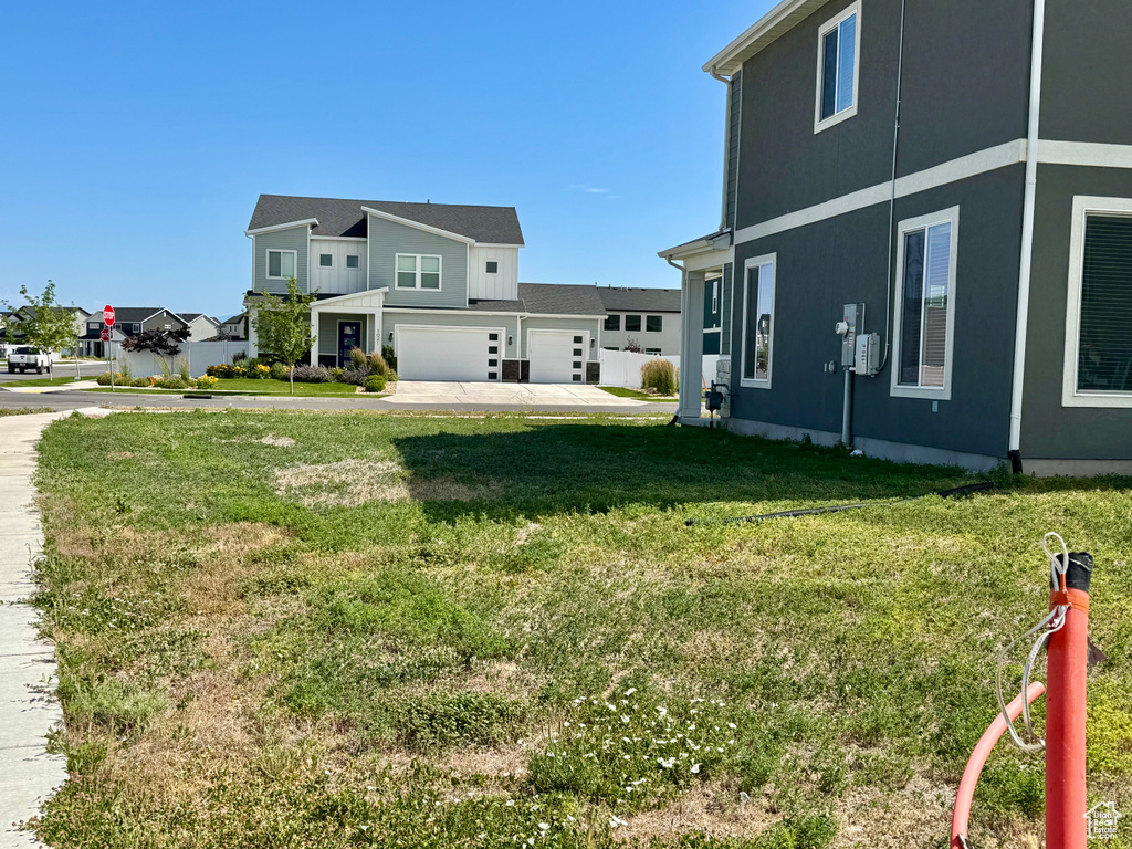 View of home's exterior featuring a yard and an attached garage