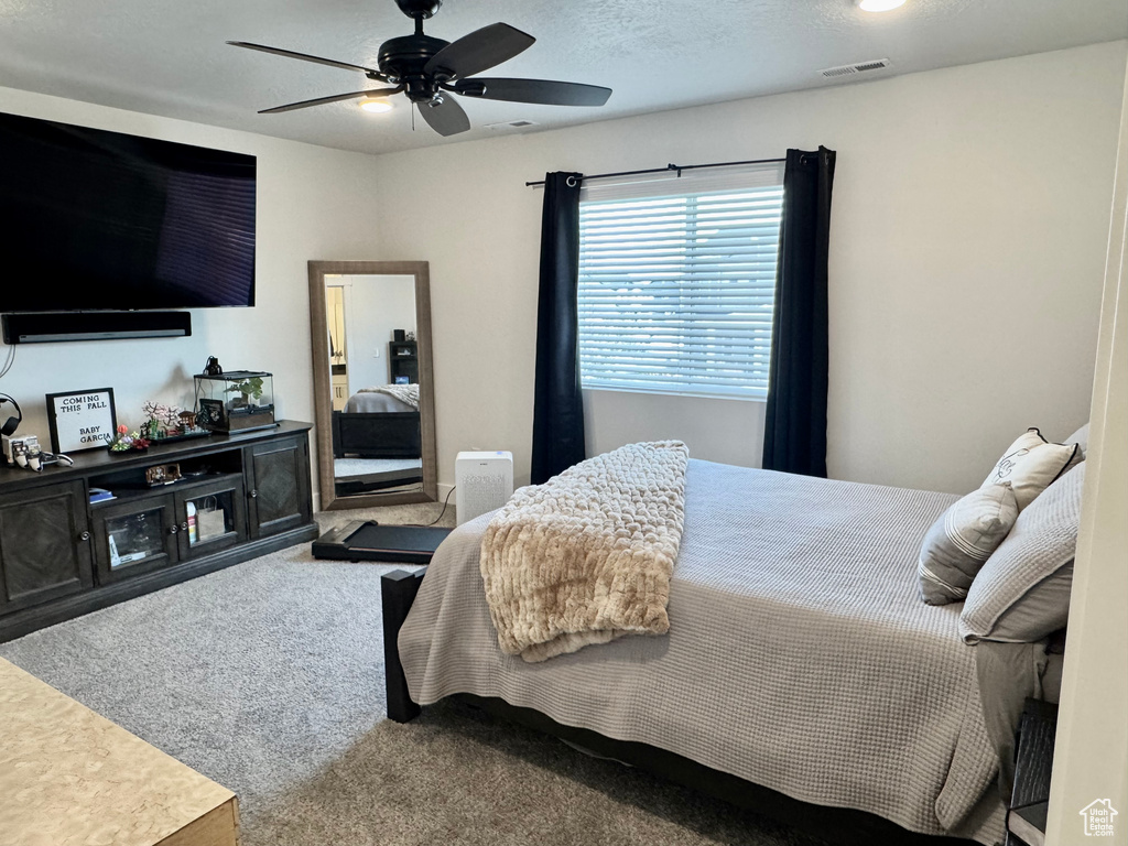 Bedroom featuring carpet floors and a ceiling fan
