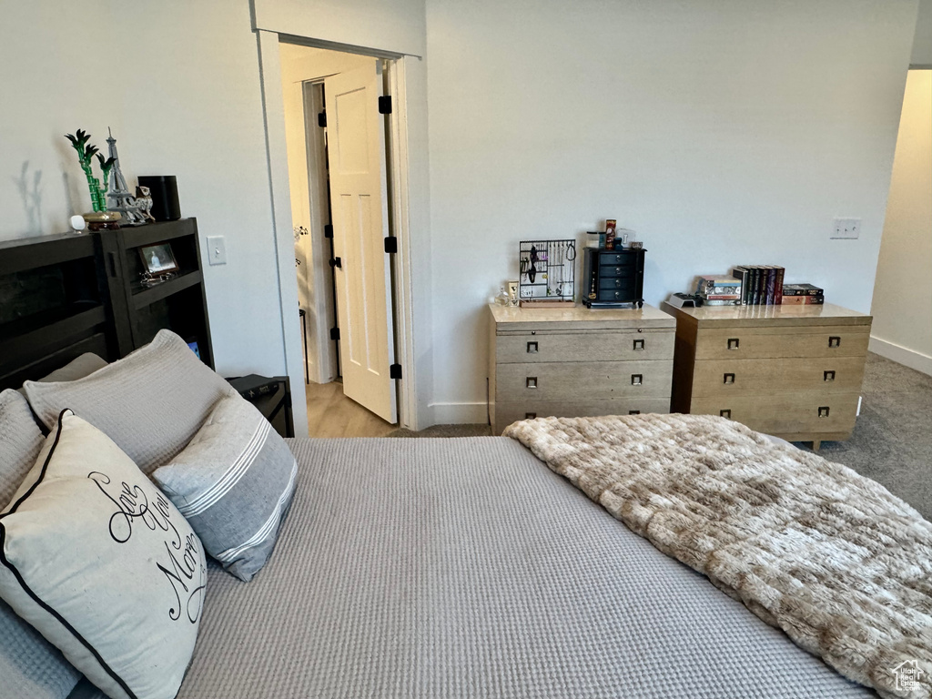 Carpeted bedroom with baseboards