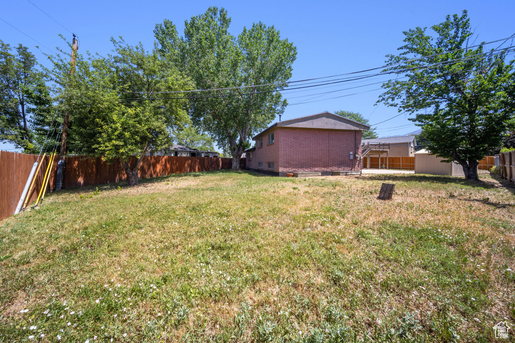 View of fenced backyard