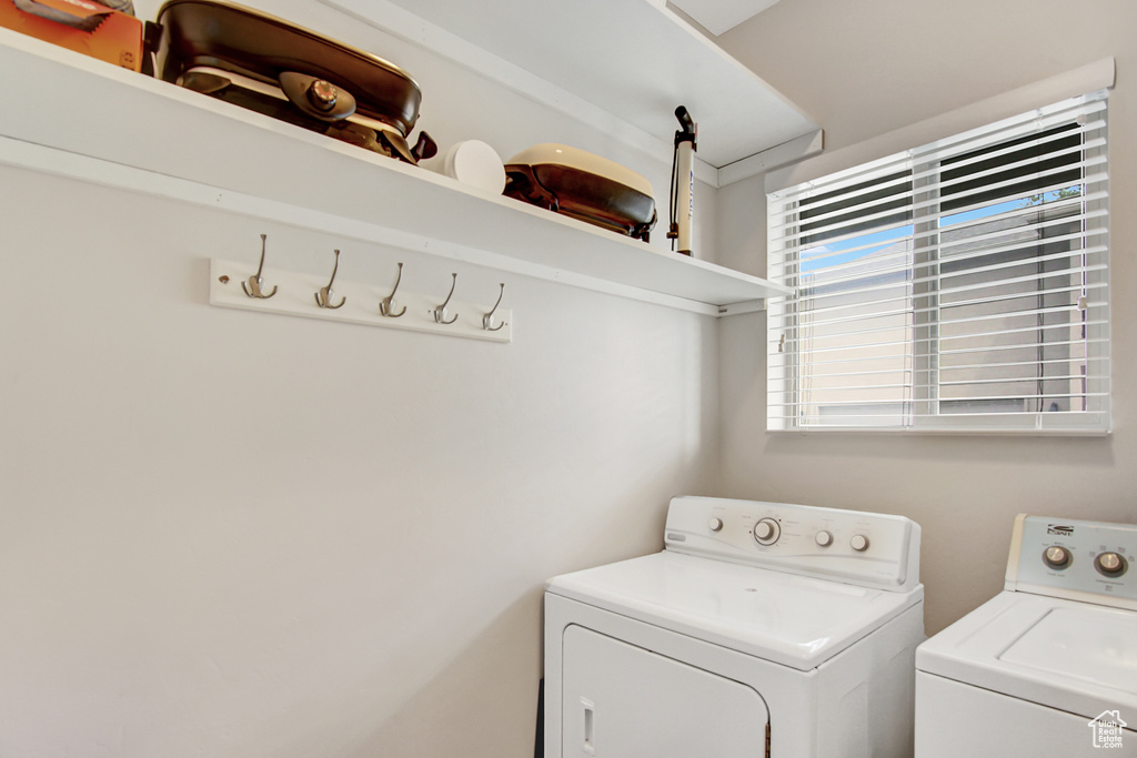 Washroom with washer and clothes dryer