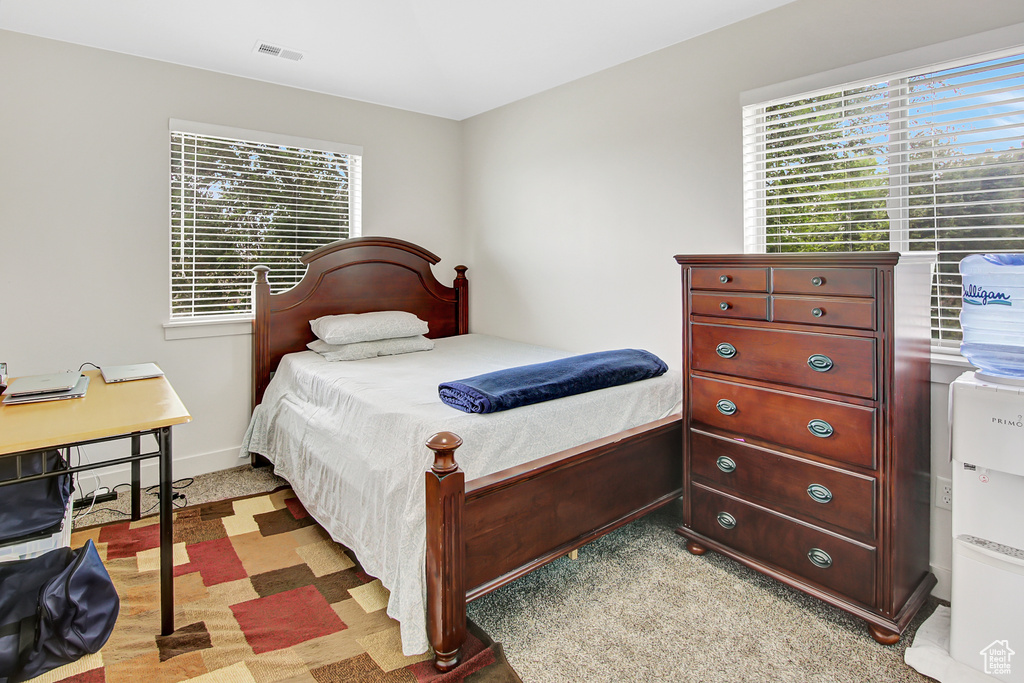 Bedroom with multiple windows