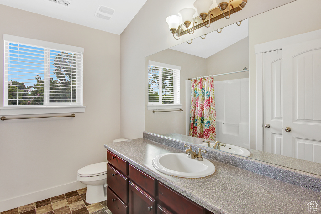 Full bath featuring vanity and a shower with curtain