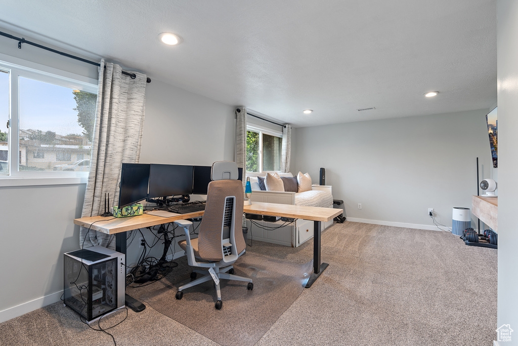 Carpeted home office featuring recessed lighting and baseboards