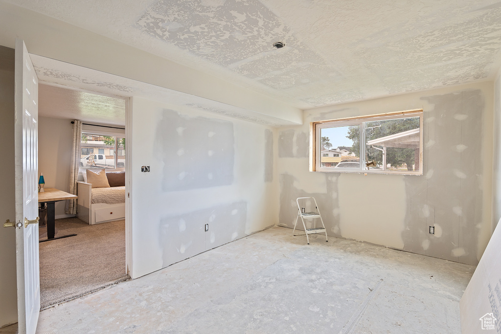 Unfurnished bedroom with a textured ceiling