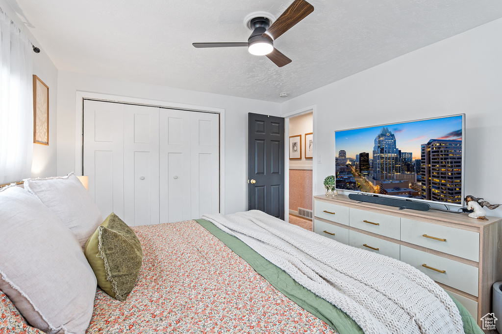 Bedroom featuring a closet and a ceiling fan