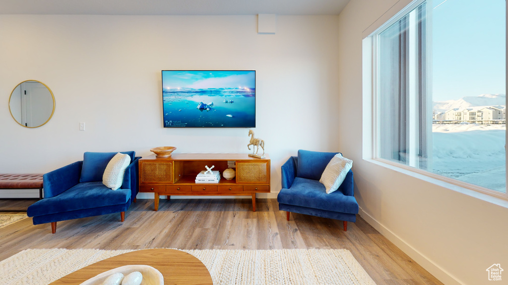 Living room featuring wood finished floors and baseboards