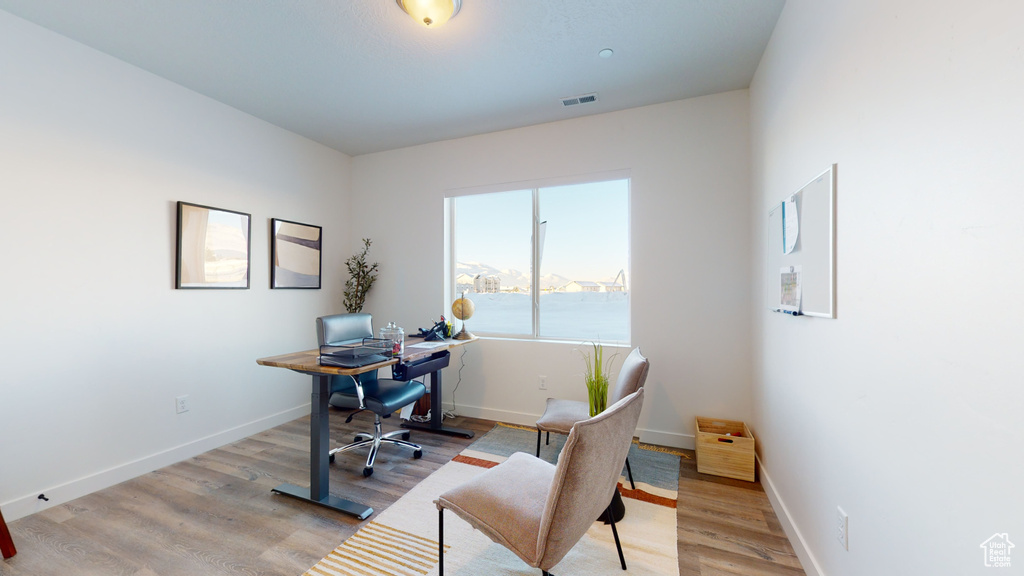 Office area featuring light wood-type flooring