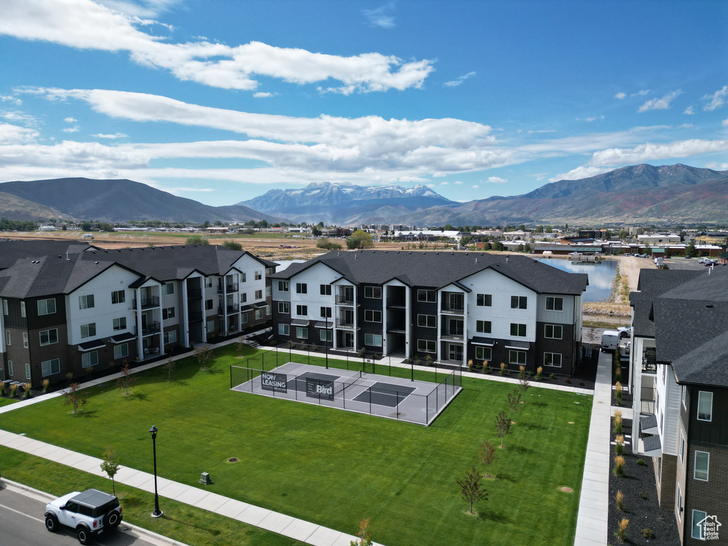 Aerial perspective of suburban area featuring a mountainous background