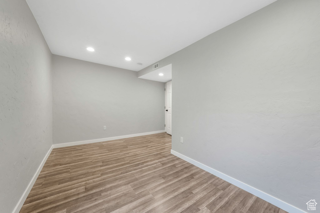 Spare room with light wood-type flooring and recessed lighting