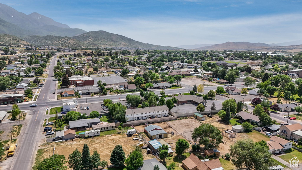Aerial view of residential area featuring a mountain backdrop