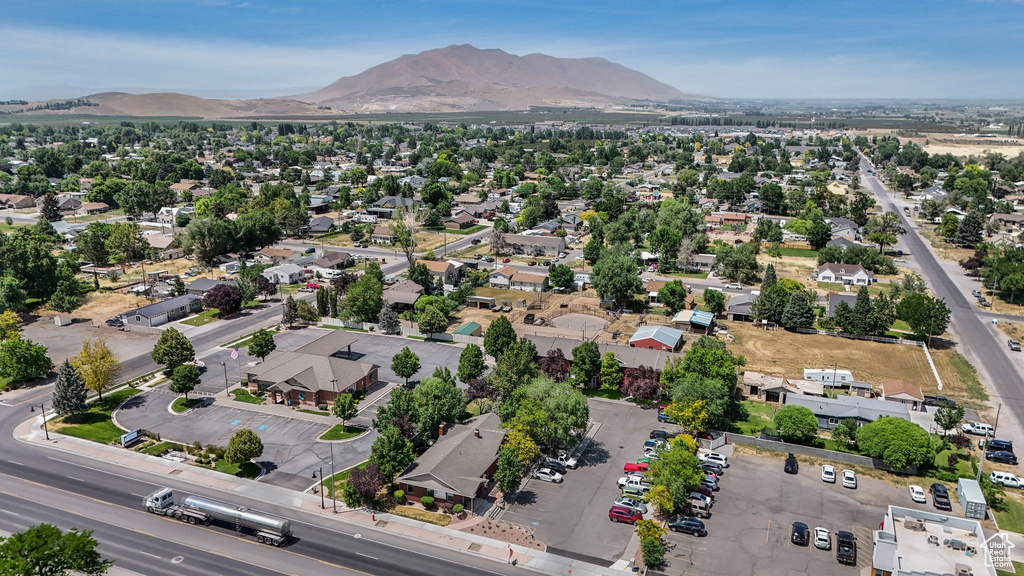 Aerial view of residential area featuring a mountain backdrop