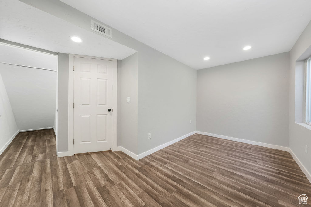 Below grade area featuring wood finished floors and recessed lighting