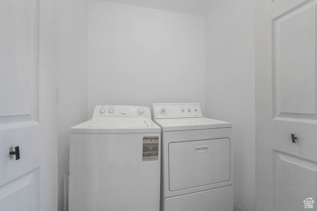 Laundry room with washer and clothes dryer