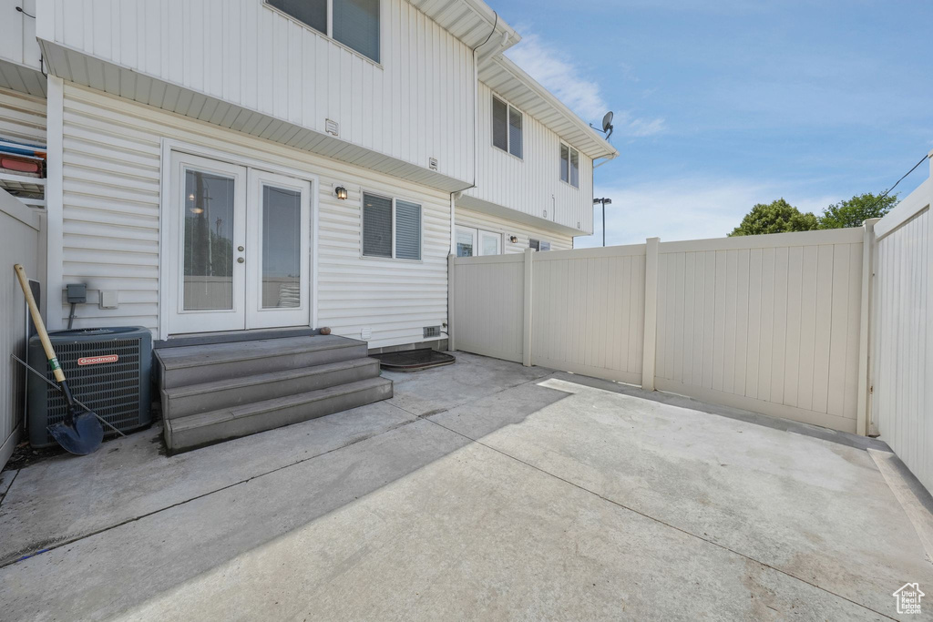 Fenced backyard with french doors, a patio, and entry steps