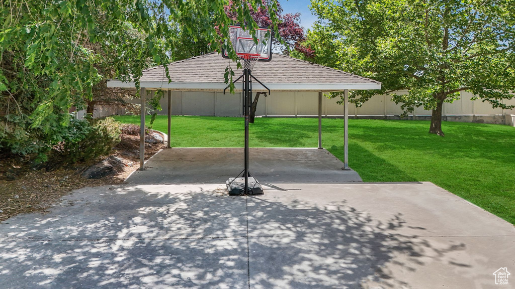 Fenced backyard featuring a gazebo and a patio