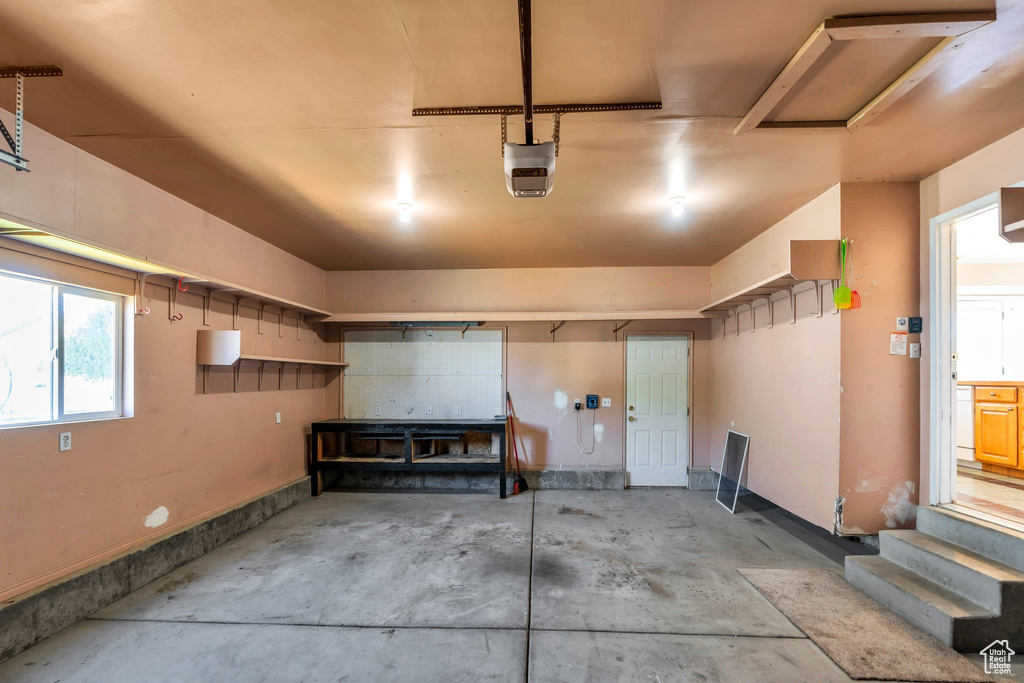 Garage featuring a garage door opener