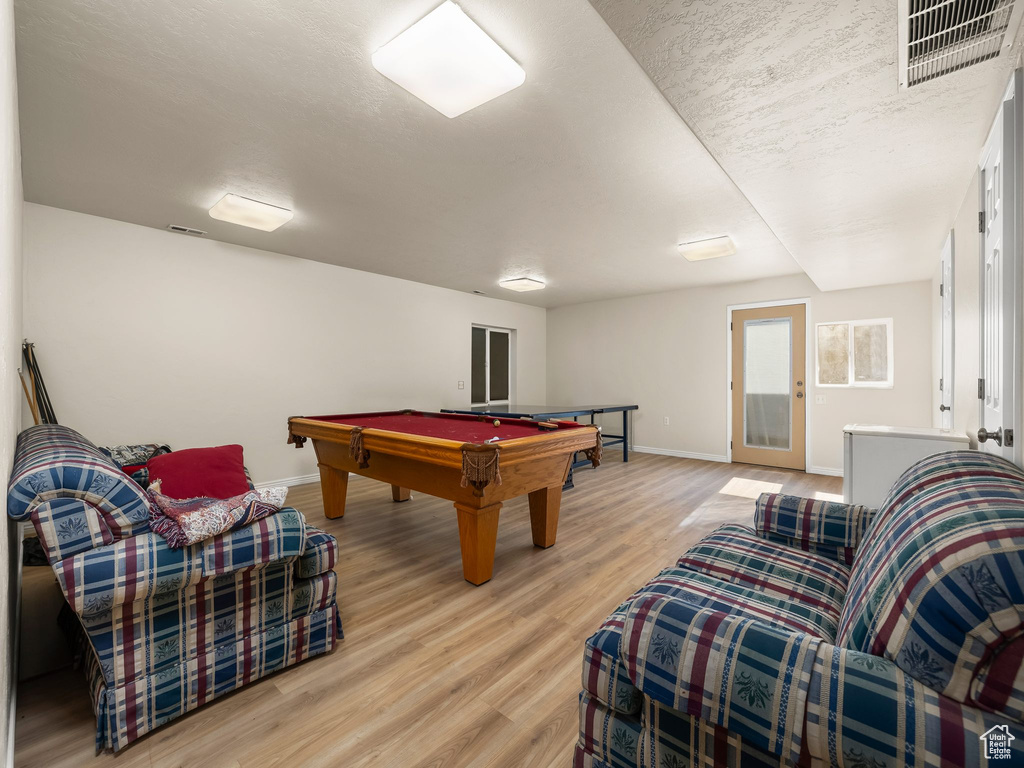 Game room featuring wood finished floors and pool table