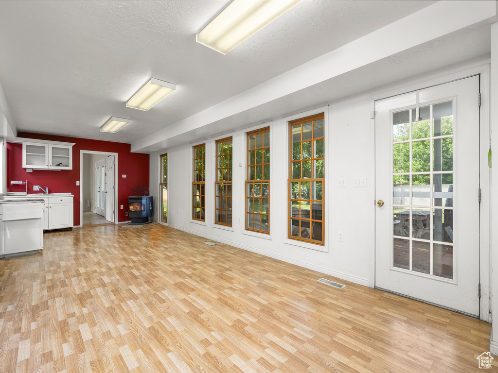 Unfurnished living room featuring light wood-style floors