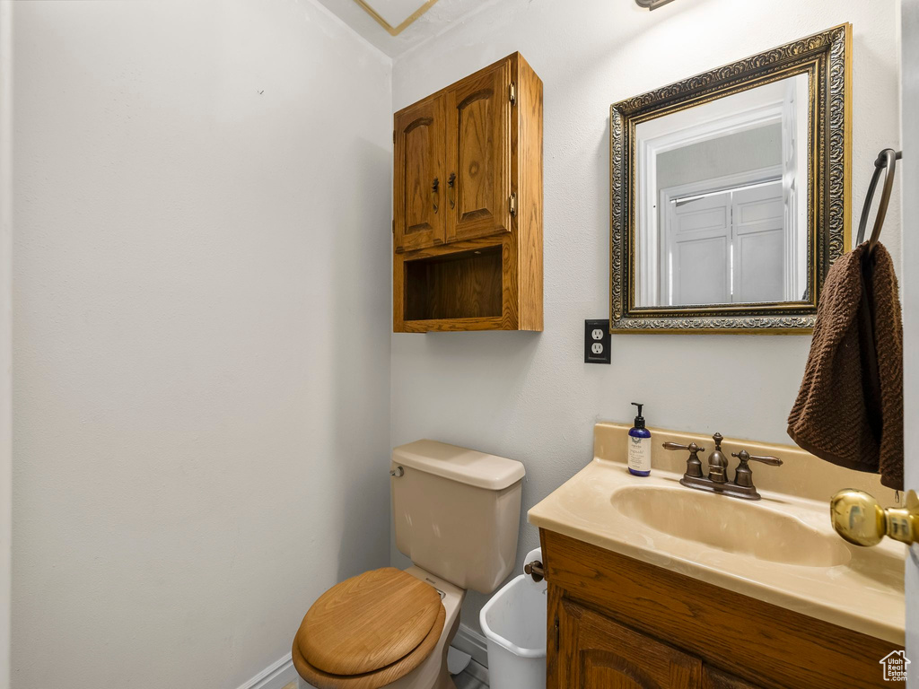 Half bath with toilet and vanity