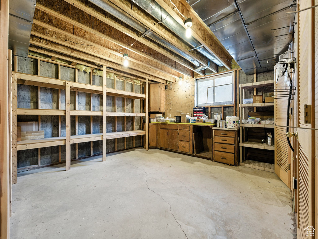 Unfinished below grade area with a workshop area