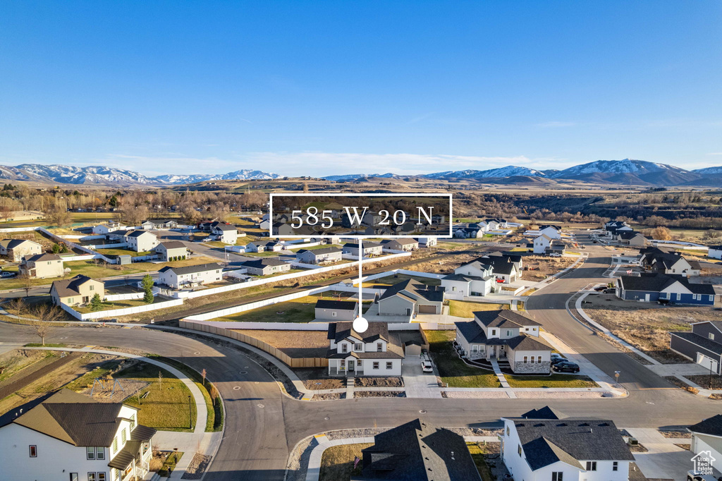 Aerial view of residential area featuring a mountain backdrop