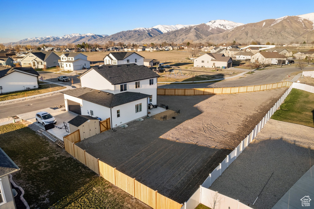 Aerial perspective of suburban area featuring a mountainous background