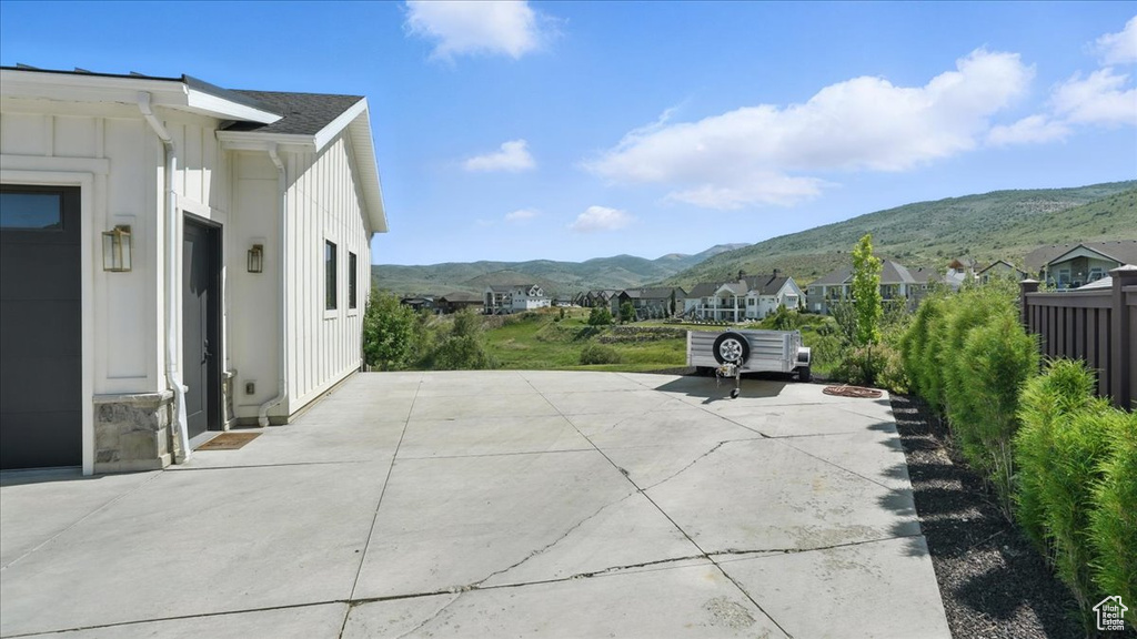View of patio / terrace featuring a mountain view and a residential view