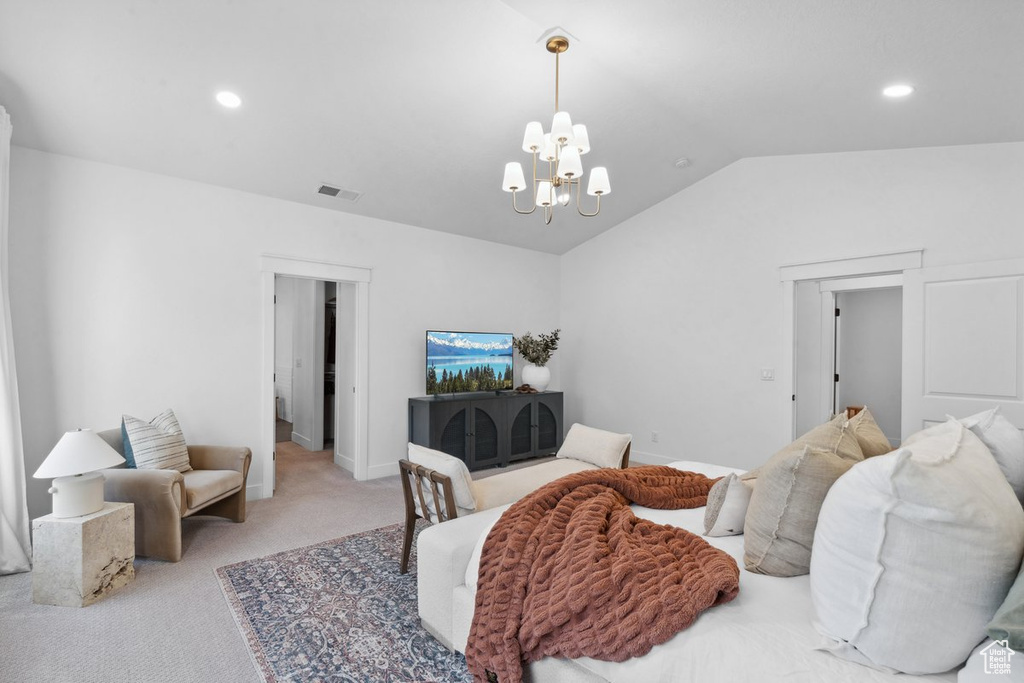 Carpeted bedroom with a chandelier, lofted ceiling, and recessed lighting