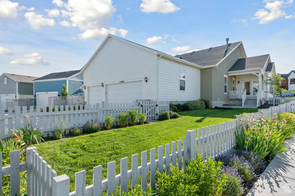 View of property exterior with a garage
