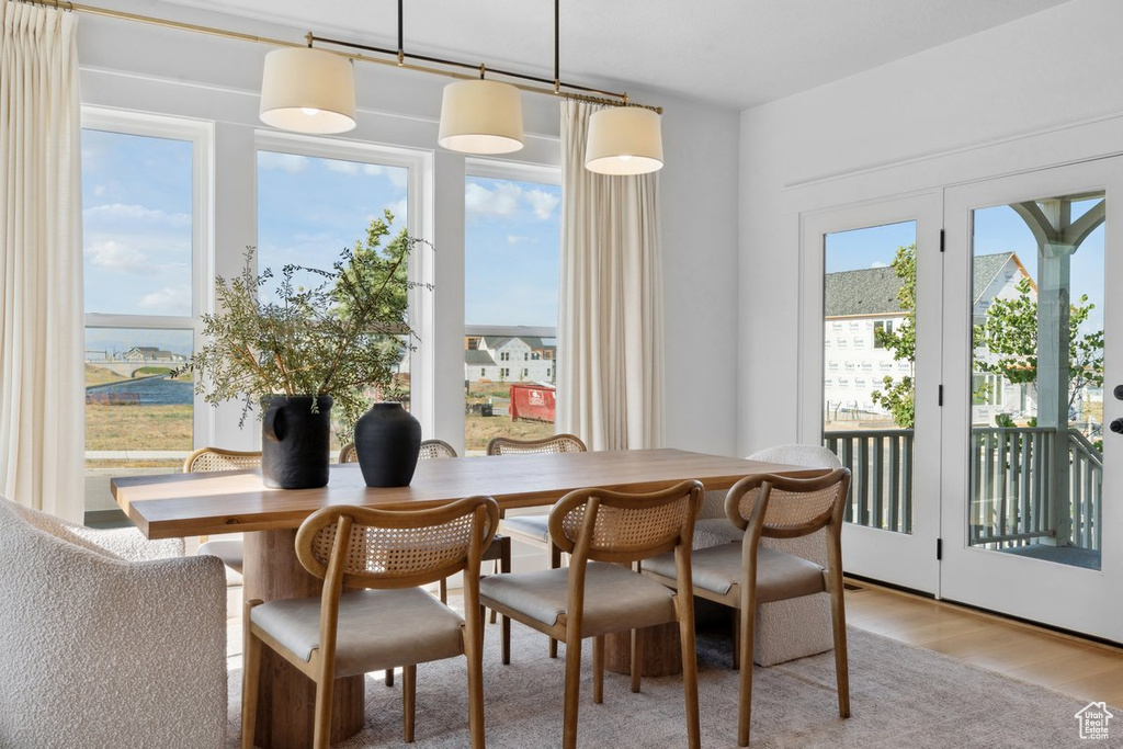 Dining space with light wood-style floors