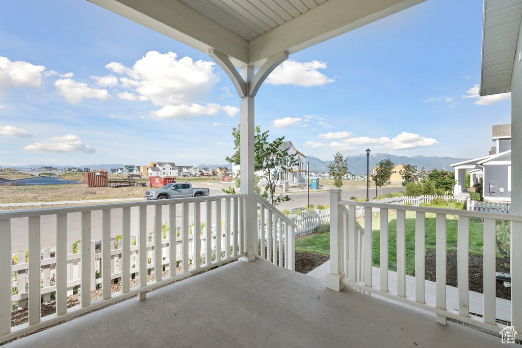 Porch featuring a mountain view and a residential view
