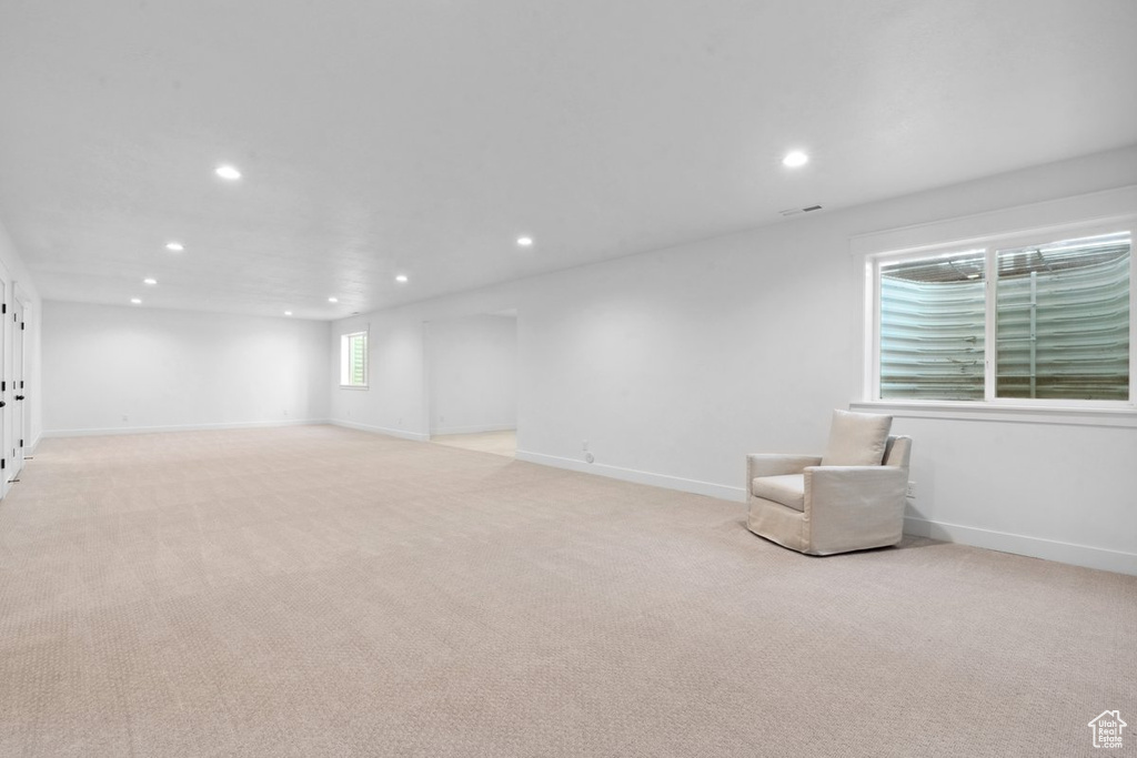 Unfurnished room with recessed lighting and light colored carpet