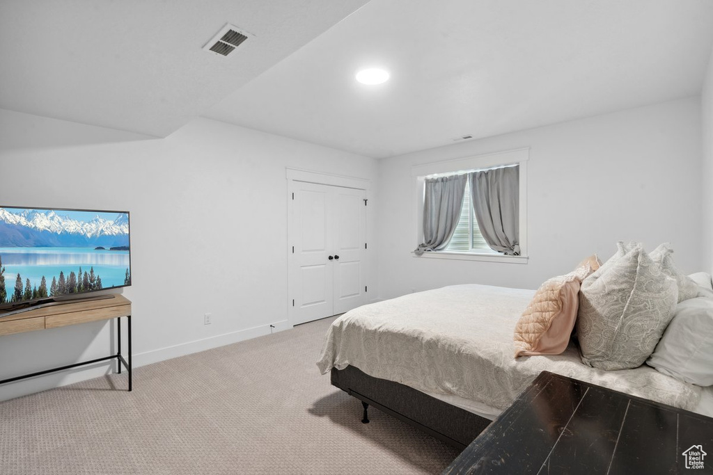 Bedroom with carpet floors and a closet