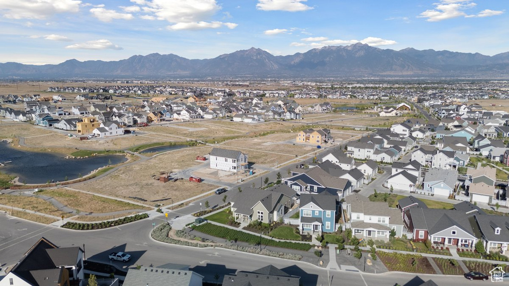 View of property location with nearby suburban area and a water and mountain view