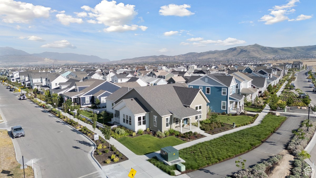 Aerial perspective of suburban area featuring a mountainous background